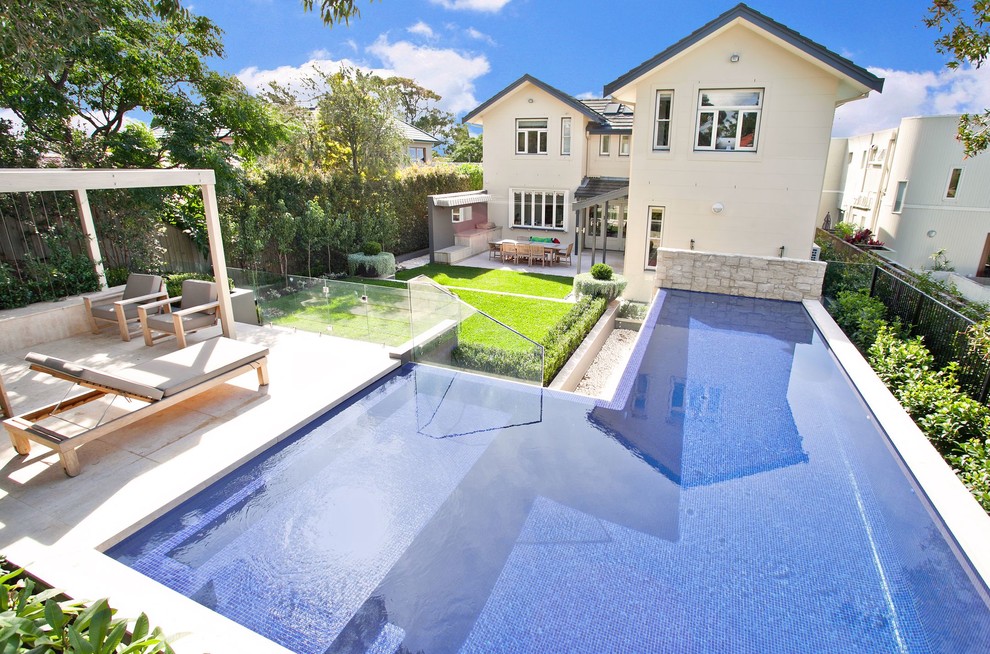 This is an example of a contemporary l-shaped swimming pool in Sydney.