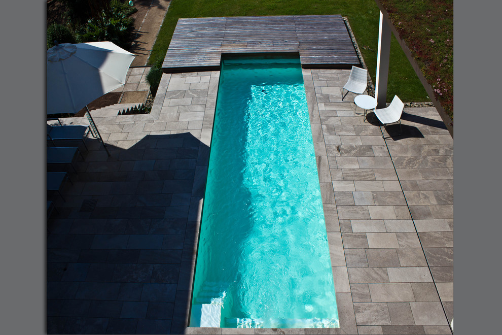 Contemporary swimming pool in Other.