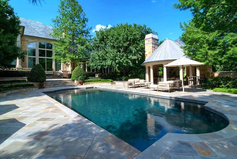 Traditional rectangular swimming pool in Dallas with fencing.
