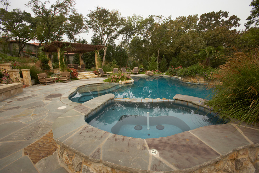 This is an example of a rustic swimming pool in Dallas.