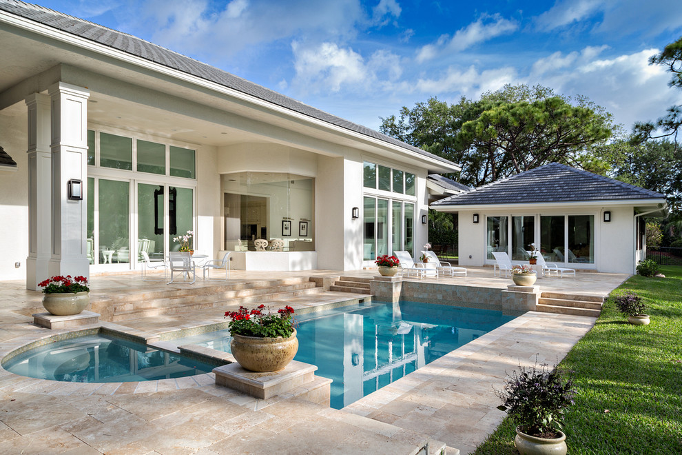 Design ideas for a large traditional swimming pool in Miami.