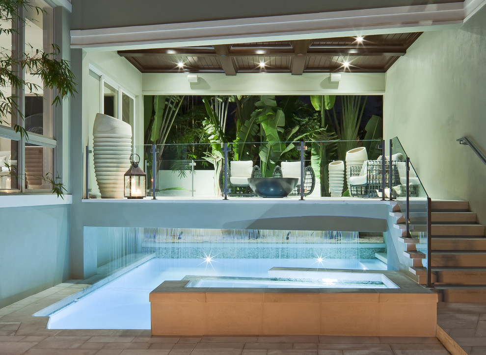 Inspiration for a small contemporary courtyard custom-shaped pool fountain remodel in Miami