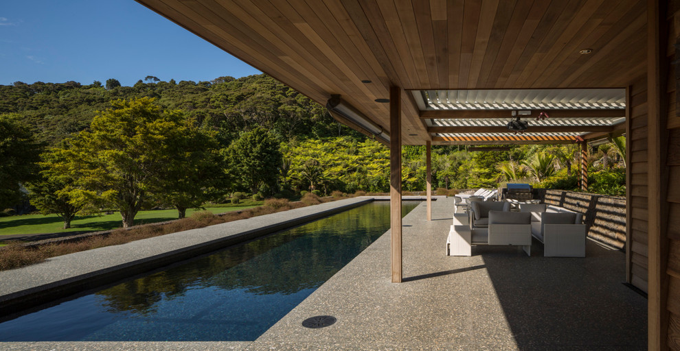 Mid-sized trendy rectangular pool photo in Auckland