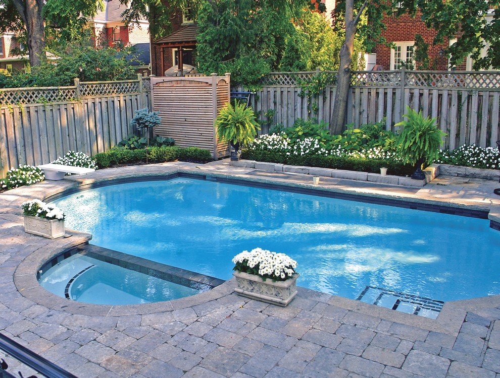 Small trendy backyard concrete paver and rectangular lap hot tub photo in Toronto