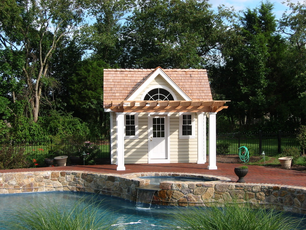 Pool house - traditional custom-shaped pool house idea in Philadelphia