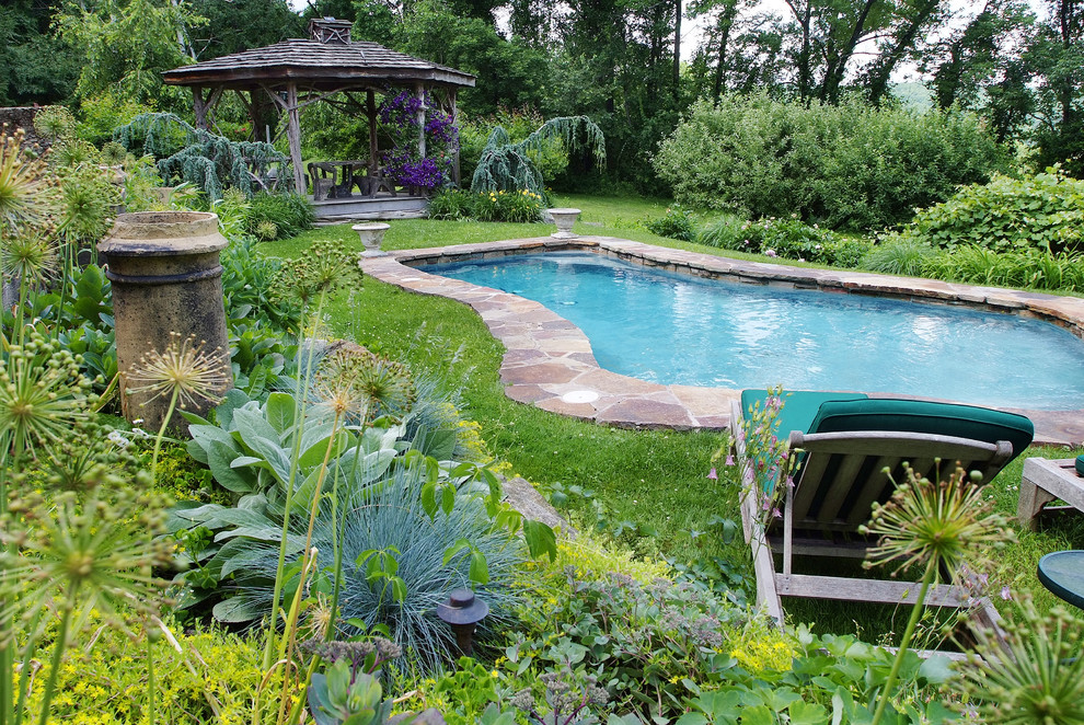 Inspiration for a traditional custom shaped swimming pool in Philadelphia.
