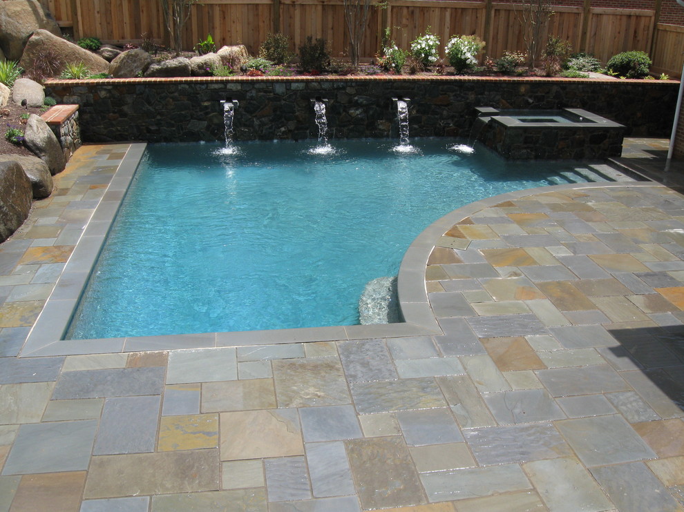 Example of a small trendy backyard stone and custom-shaped pool fountain design in Wilmington