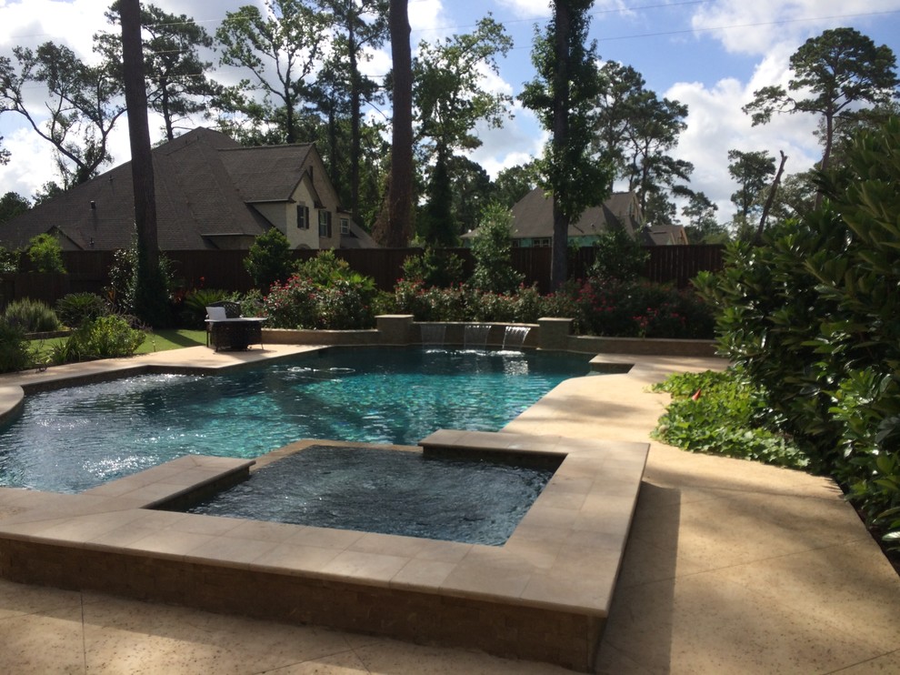 Elegant backyard custom-shaped pool photo in Houston