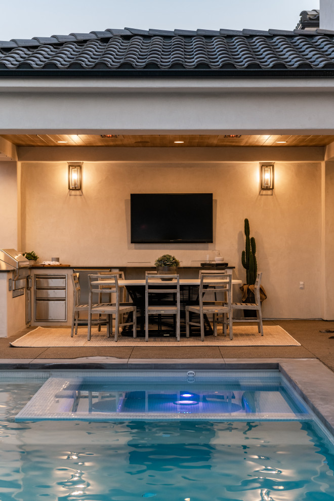 Hot tub - large modern backyard tile and rectangular lap hot tub idea in Salt Lake City