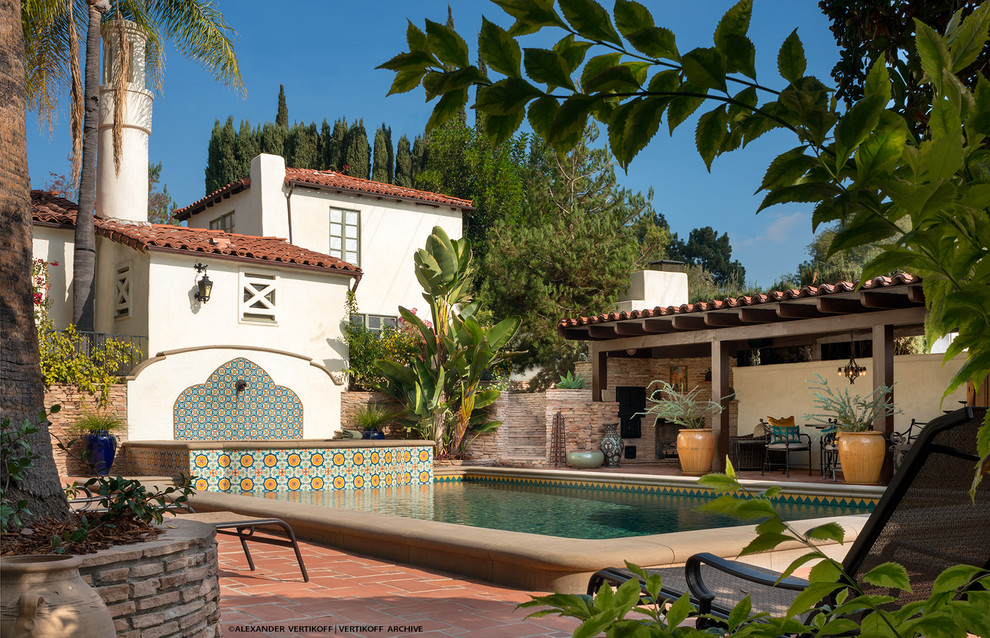 This is an example of a large mediterranean swimming pool in Los Angeles.