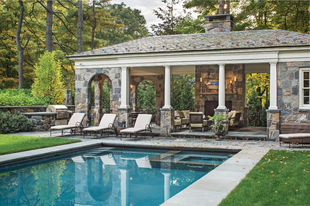 This is an example of an expansive traditional rectangular swimming pool in New York with a bbq area.