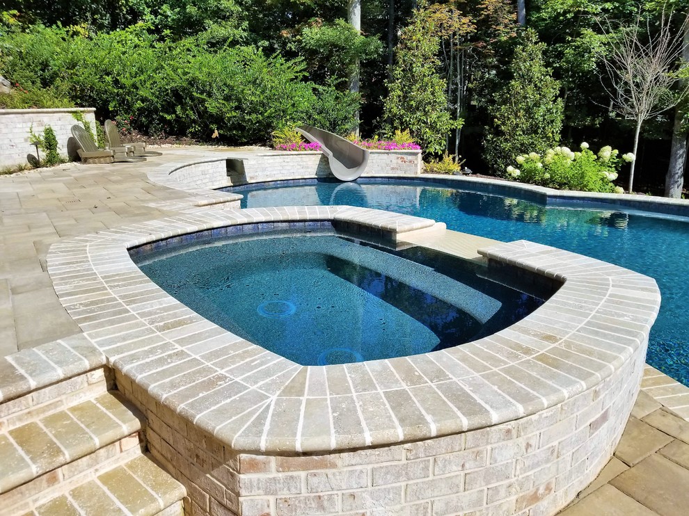 Grand Custom Pool with Water Slide Traditional Pool Atlanta by