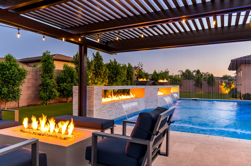 Design ideas for a large modern back rectangular swimming pool in Phoenix.