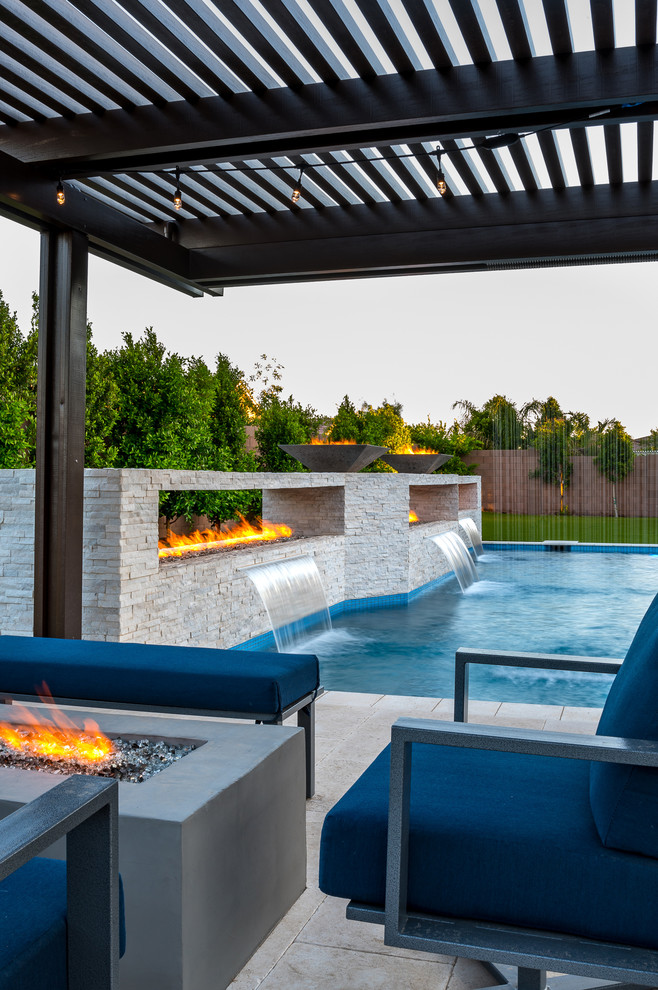 Example of a large minimalist backyard rectangular pool design in Phoenix