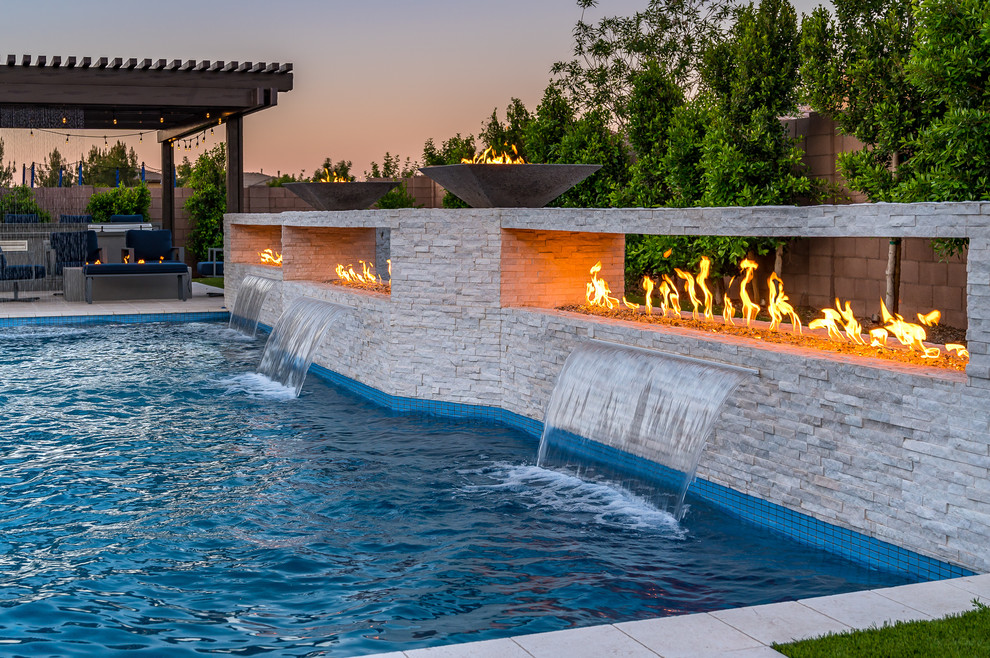 Large minimalist backyard rectangular pool photo in Phoenix