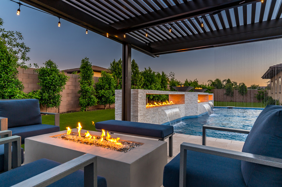 Large minimalist backyard rectangular pool photo in Phoenix