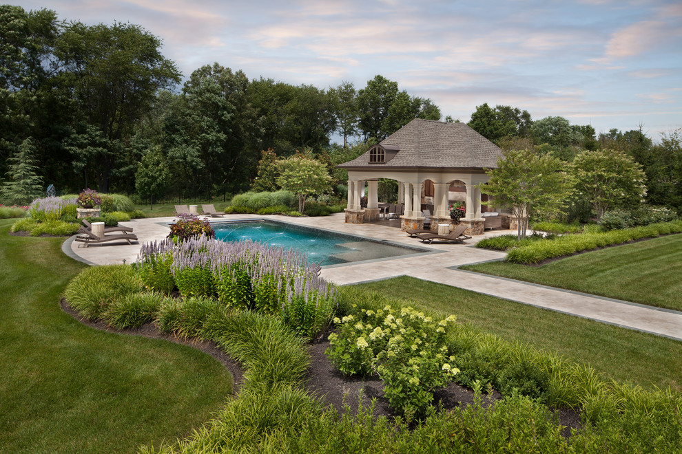 This is an example of a traditional back swimming pool in DC Metro with a pool house.