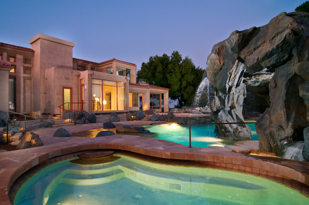 Example of a tuscan custom-shaped pool fountain design in San Francisco