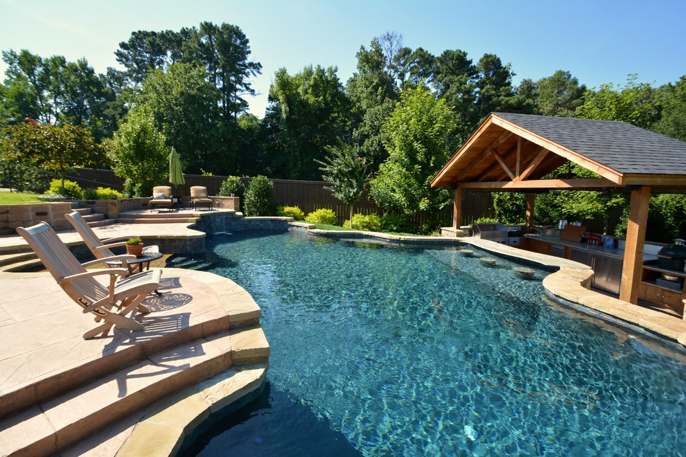 Example of a backyard custom-shaped pool design in Little Rock
