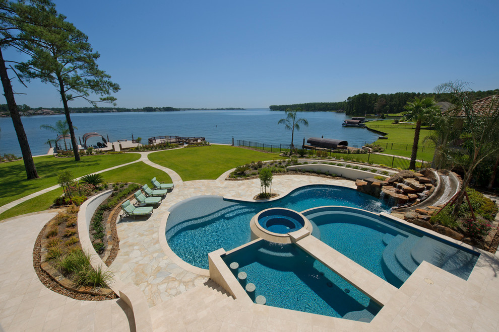 Large mediterranean custom shaped swimming pool in Houston.