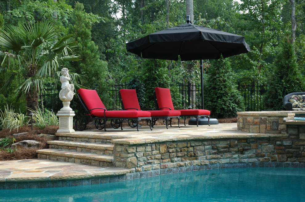 Hot tub - mid-sized transitional backyard stone and custom-shaped hot tub idea in Atlanta