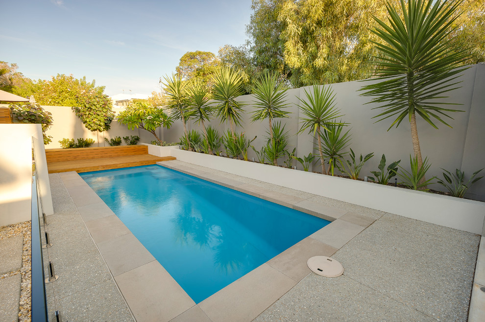 Pool - mid-sized contemporary backyard rectangular pool idea in Perth with decking