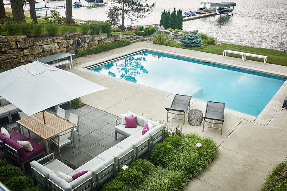 Photo of a large contemporary back rectangular swimming pool in Grand Rapids.