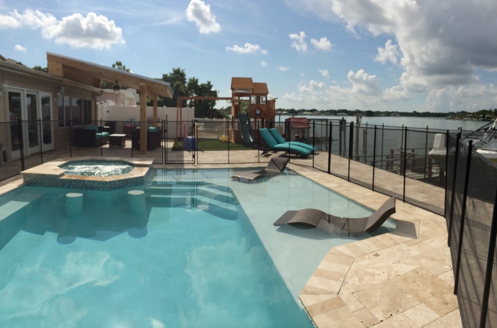 This is an example of a contemporary swimming pool in Tampa.