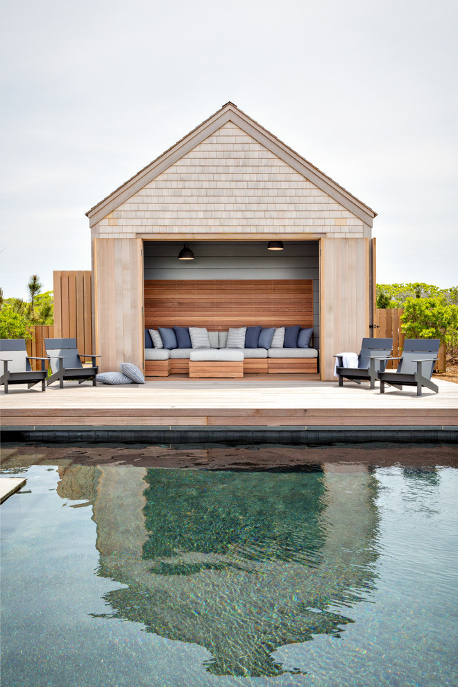Trendy pool house photo in Boston with decking