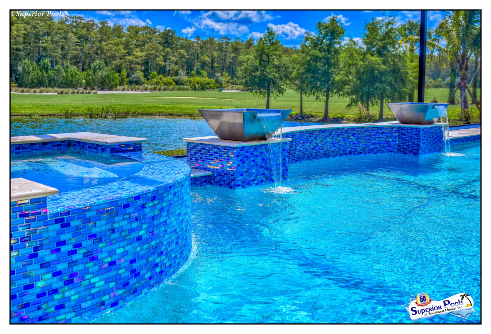 Inspiration for a large timeless backyard stone and rectangular lap pool house remodel in Tampa