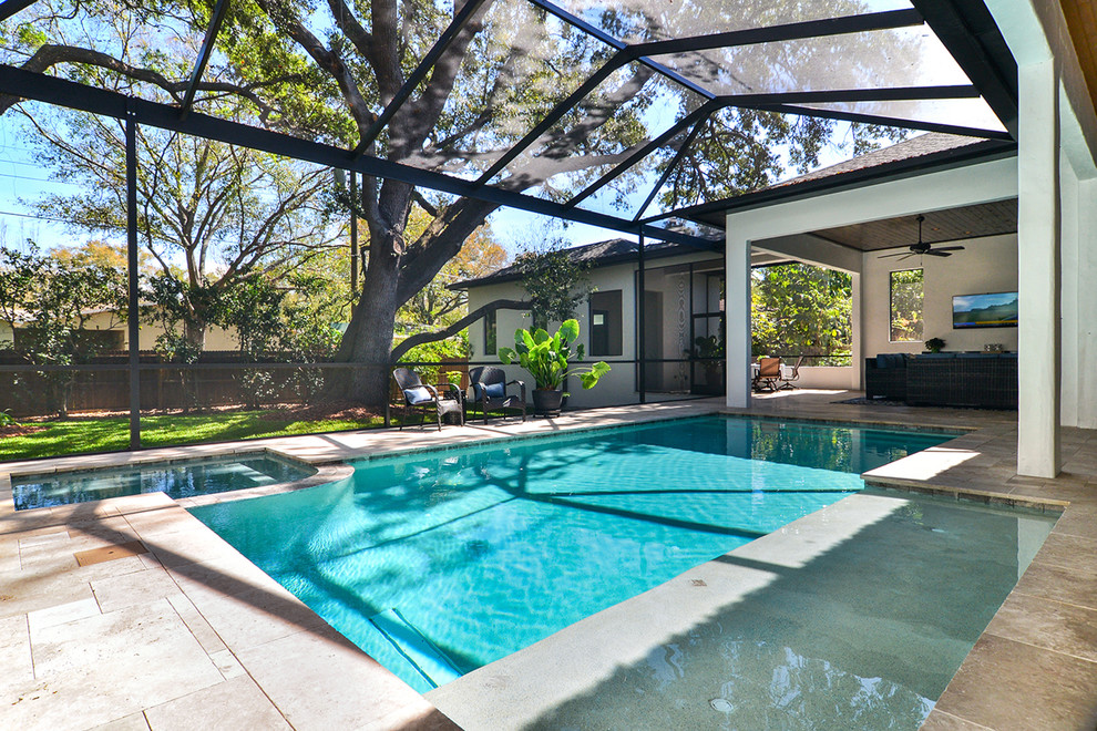 Large trendy backyard stone and rectangular lap hot tub photo in Tampa