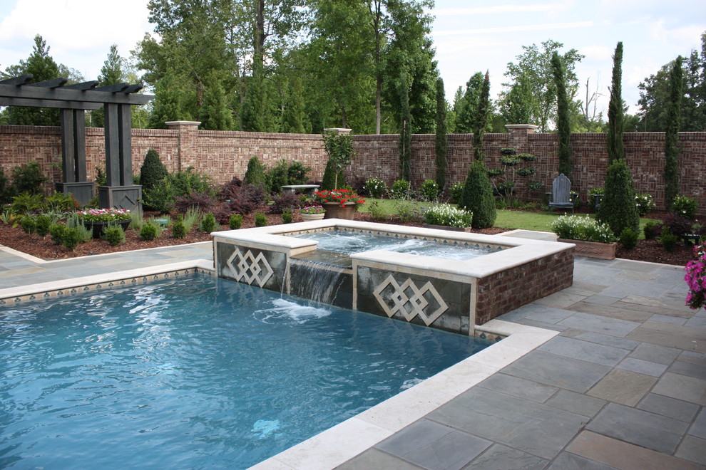 Pool - traditional backyard rectangular pool idea in Jackson