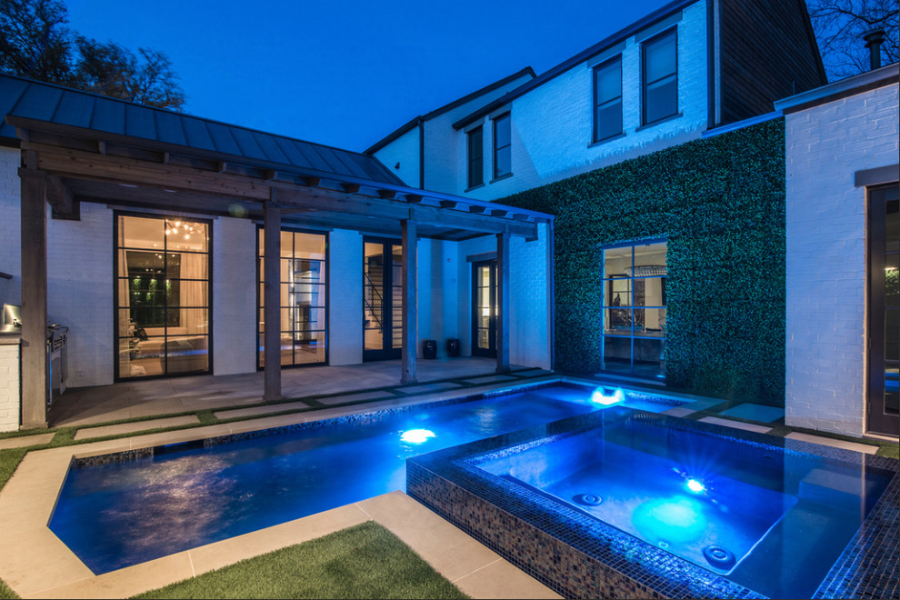 Hot tub - small contemporary backyard tile and rectangular infinity hot tub idea in Dallas
