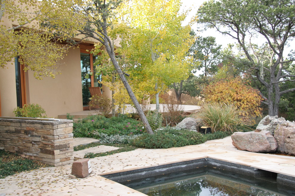 Hot tub - southwestern stone and rectangular hot tub idea in Albuquerque