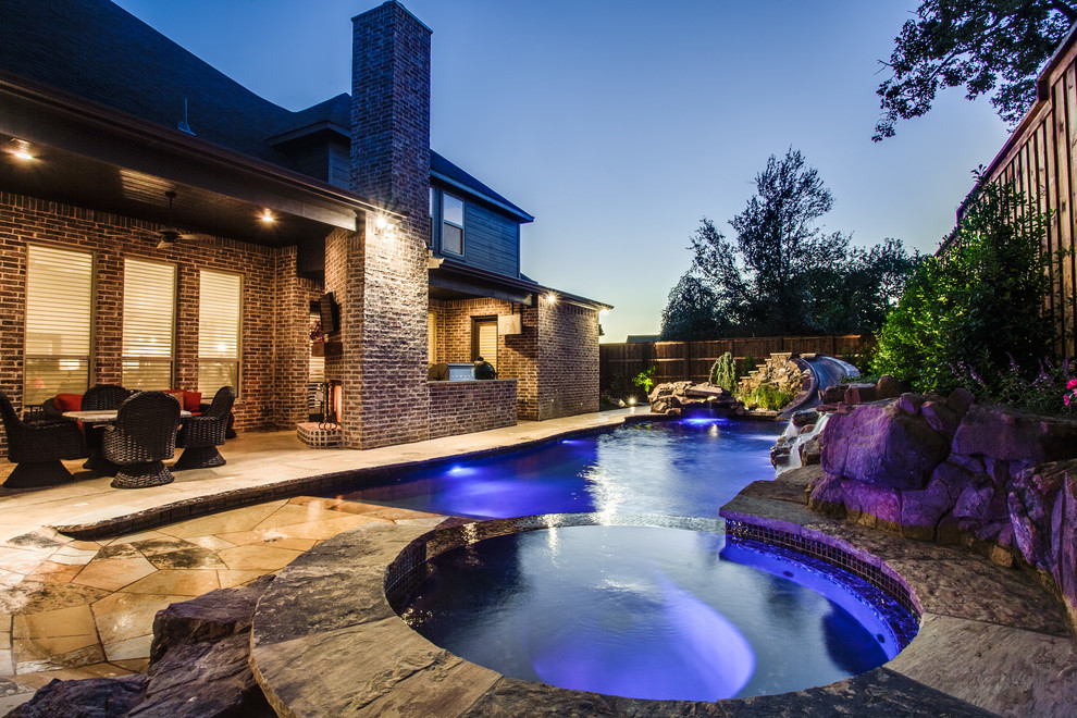 Inspiration for a small tropical backyard custom-shaped natural pool fountain remodel in Dallas
