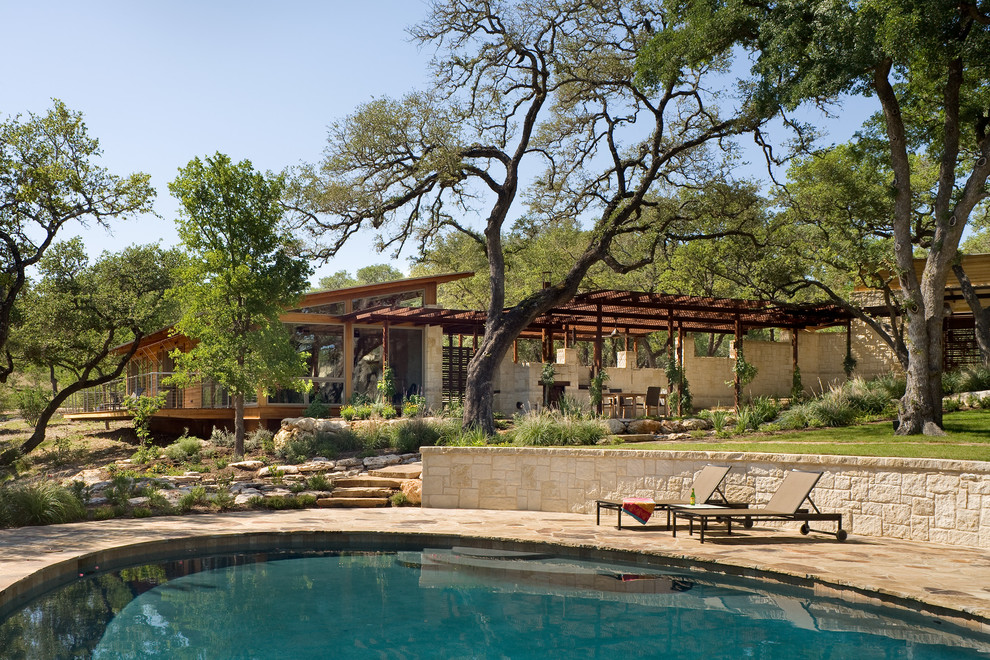 Inspiration for a rustic pool remodel in Austin