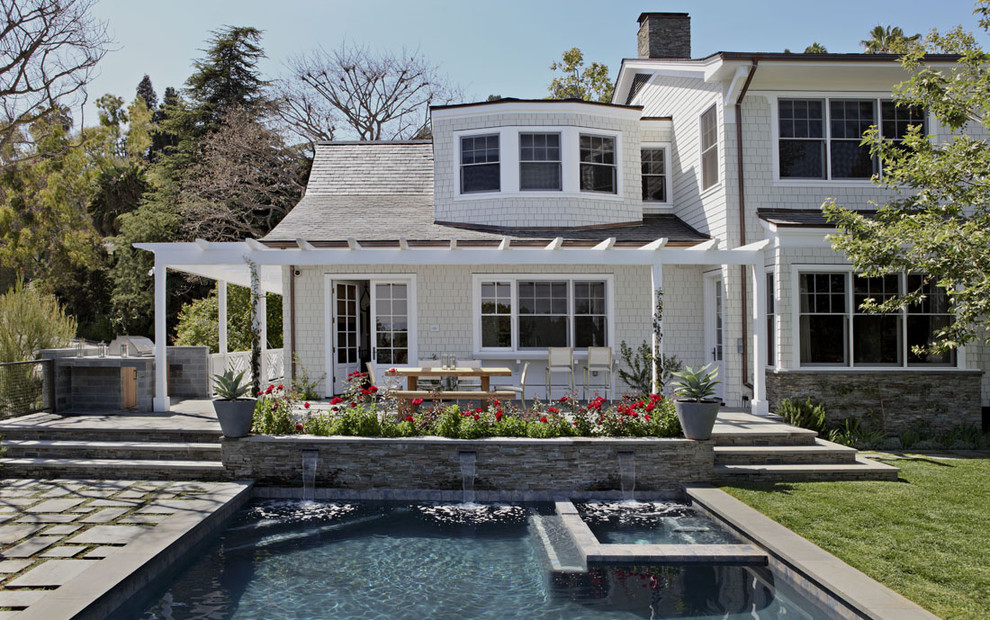 Traditional rectangular swimming pool in Los Angeles with a bbq area.