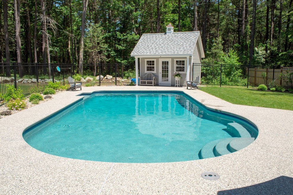 Design ideas for a medium sized classic back custom shaped lengths swimming pool in Boston with a pool house and decomposed granite.