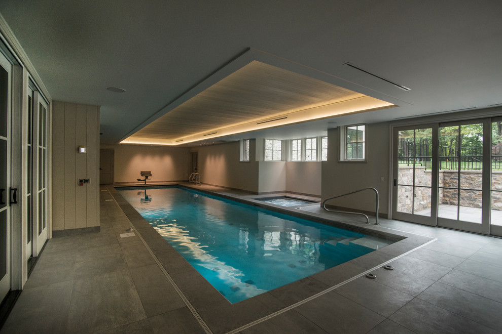 Inspiration for a mid-sized modern indoor stone and rectangular lap hot tub remodel in Chicago