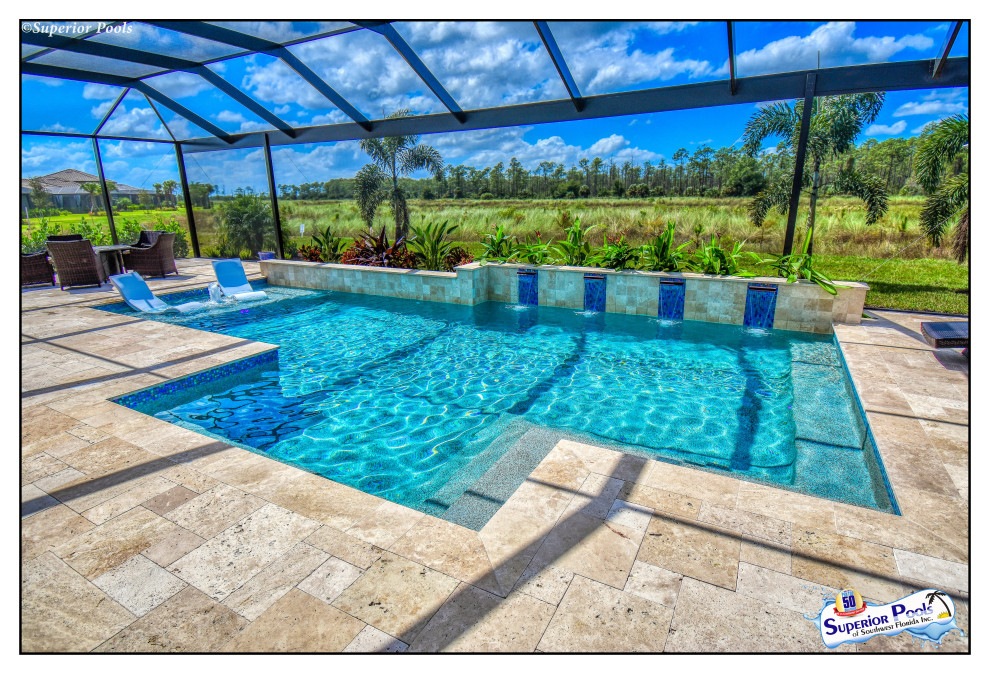 Foto de piscina contemporánea de tamaño medio rectangular en patio trasero con paisajismo de piscina y adoquines de piedra natural