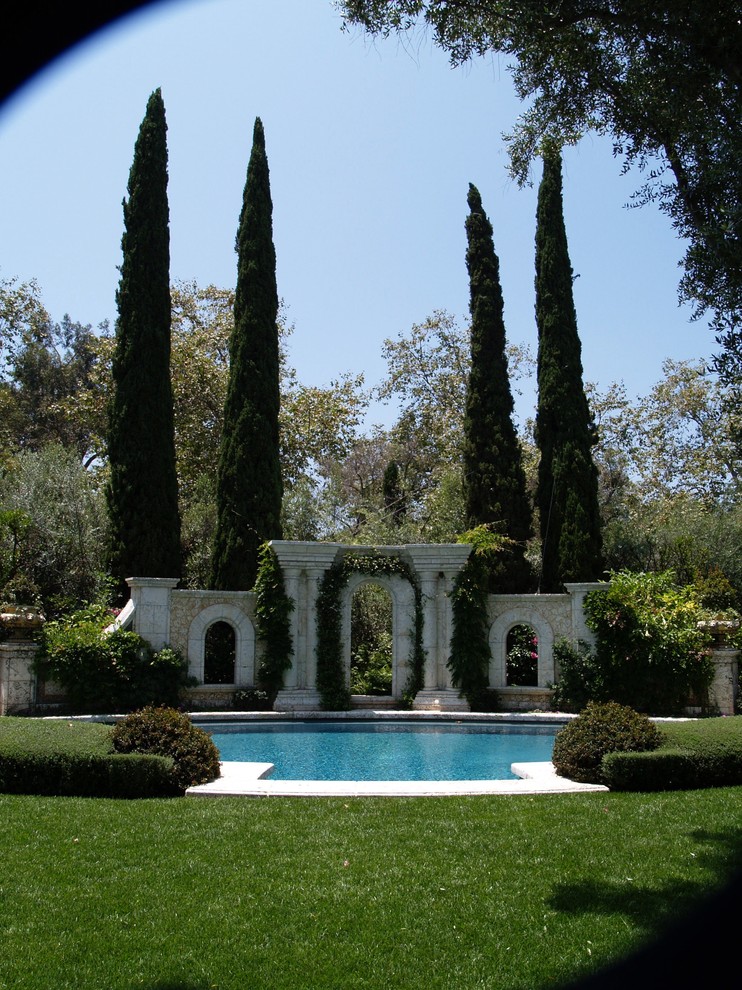 Photo of a mediterranean swimming pool in Los Angeles.