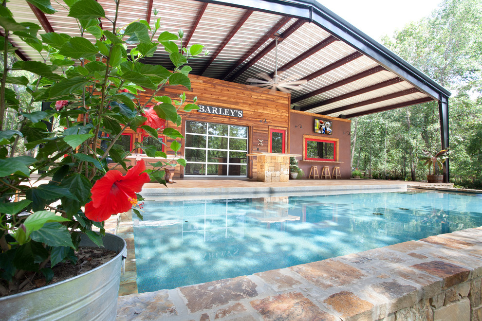 Rustic rectangular swimming pool in Dallas with brick paving.