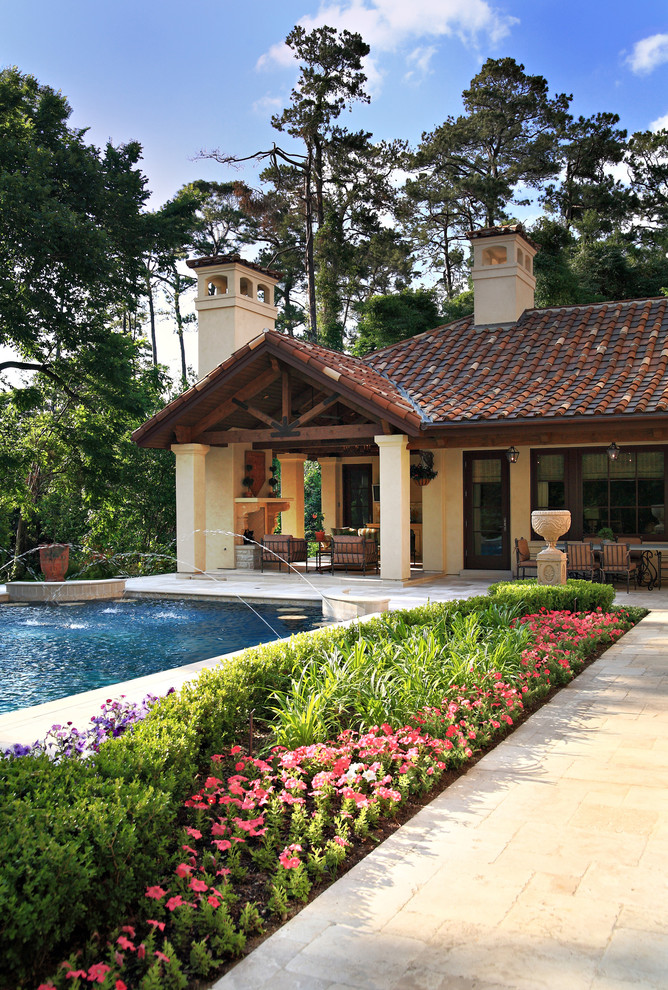 Inspiration for a huge mediterranean backyard stone and rectangular pool remodel in Houston