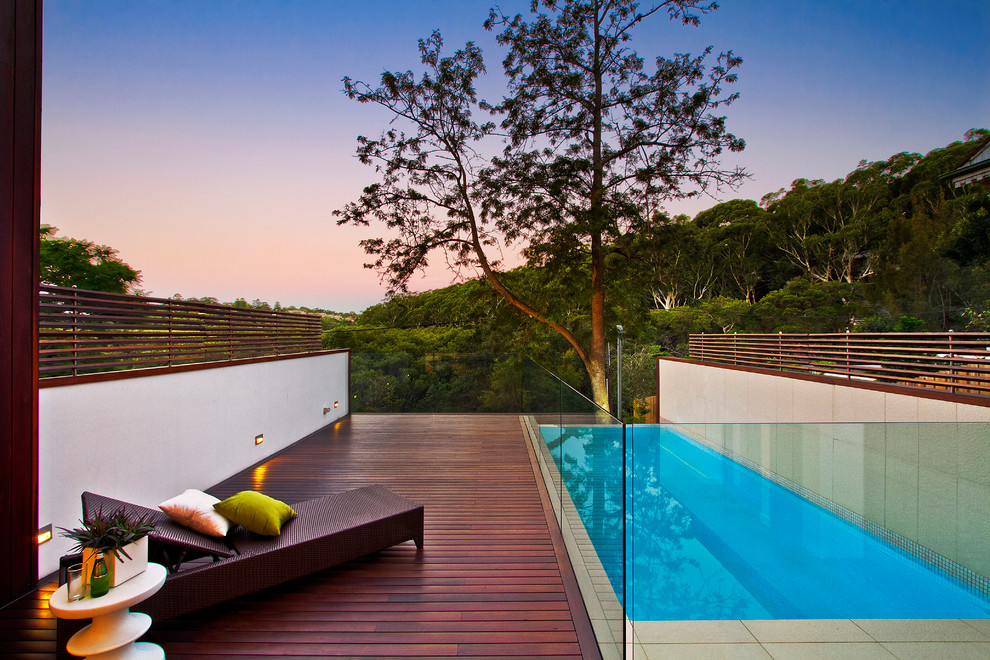 Large contemporary rectangular swimming pool in Sydney with decking.