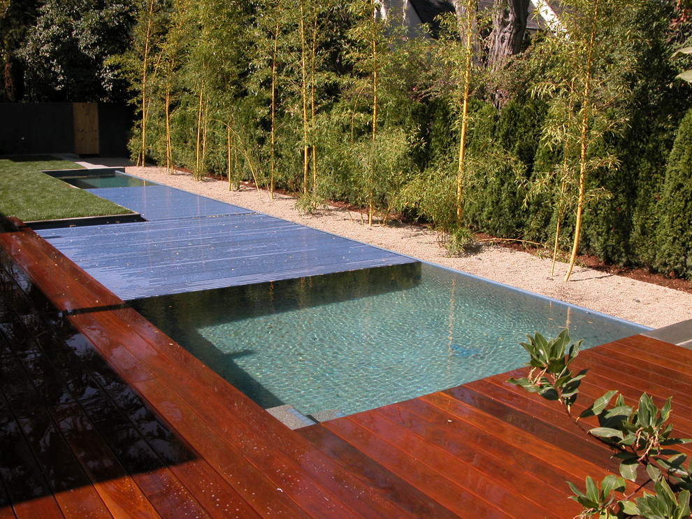 This is an example of a large contemporary back l-shaped lengths swimming pool in San Francisco.