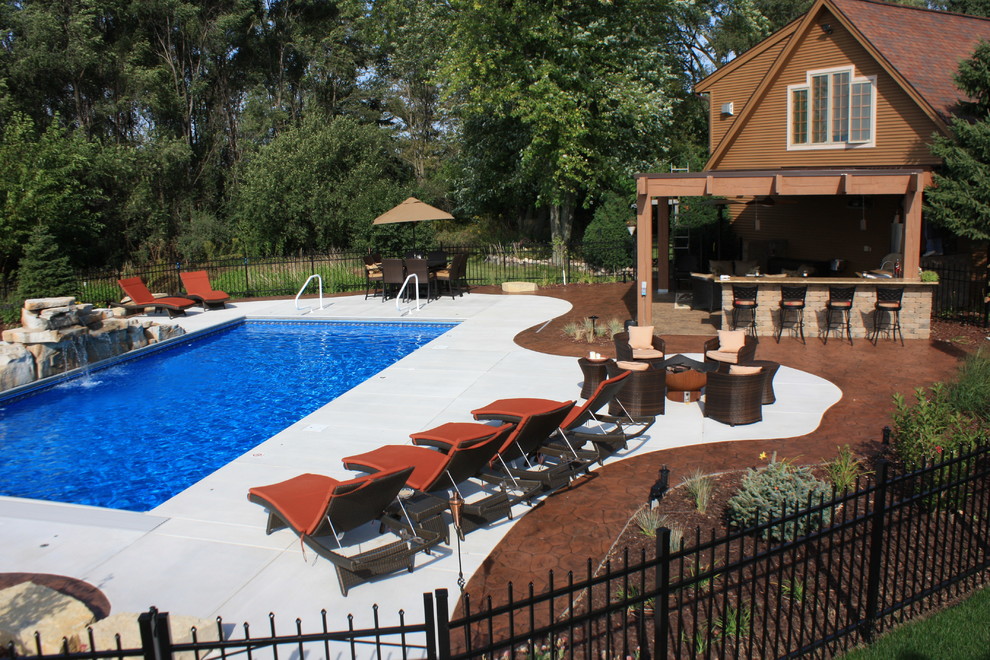 Design ideas for a contemporary swimming pool in Milwaukee.