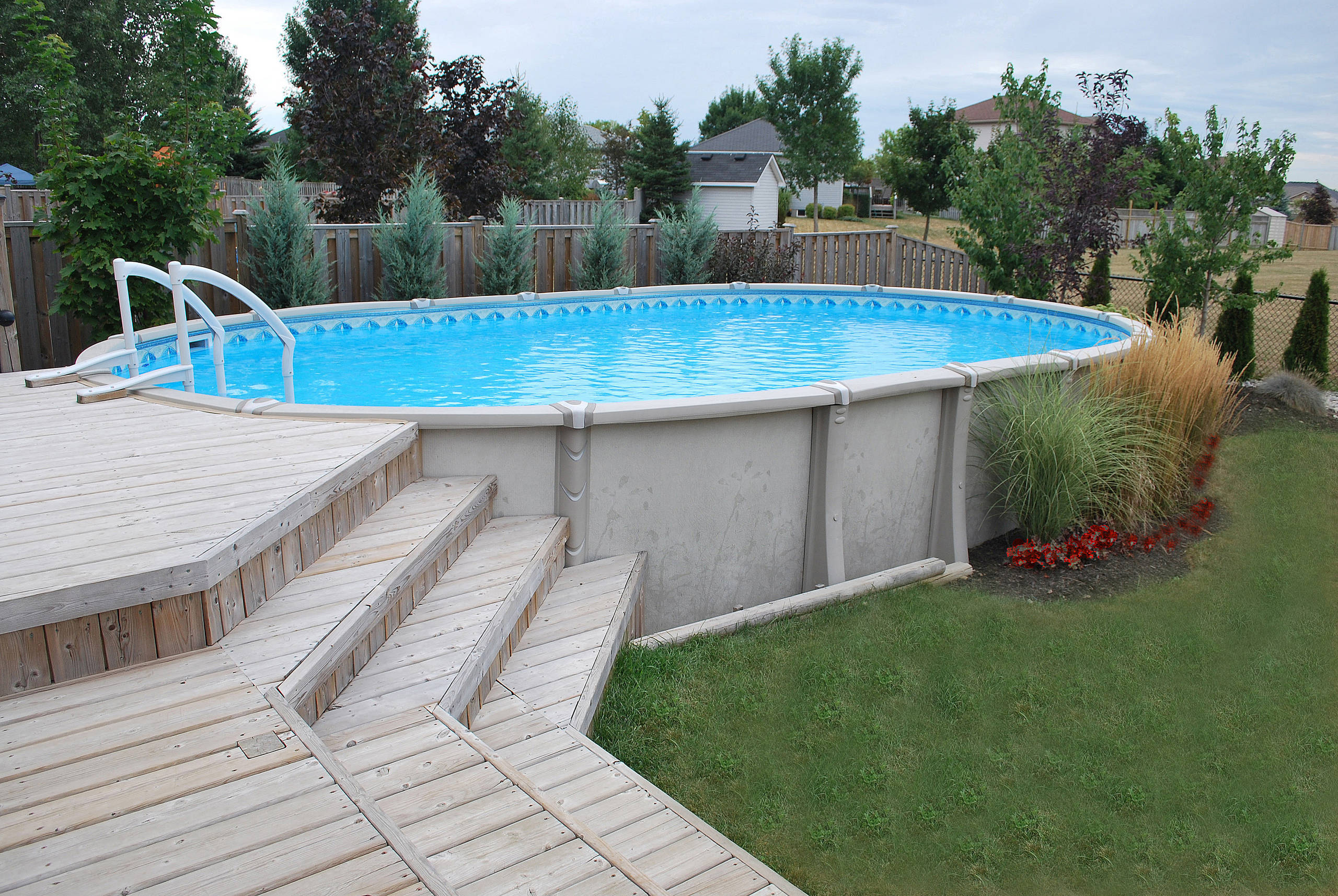 Aboveground Pool With Decking Pictures, How Much Does An Above Ground Pool With A Deck Cost