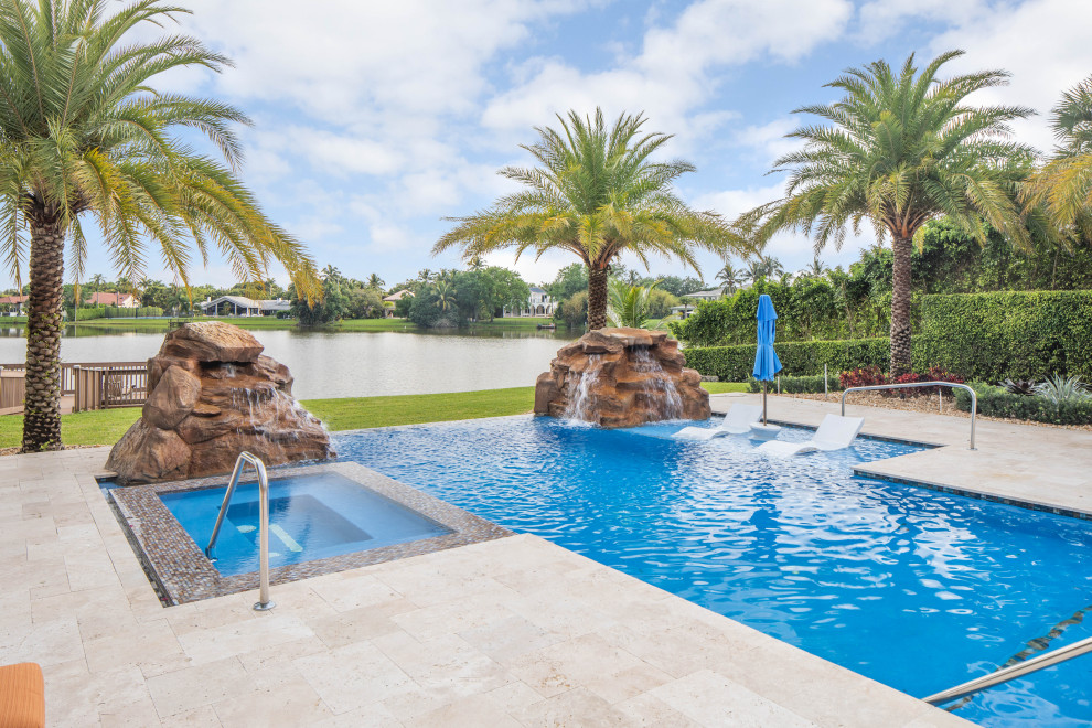 Infinity Edge Pool With Custom Rock Waterfalls and Custom Spa in Boca