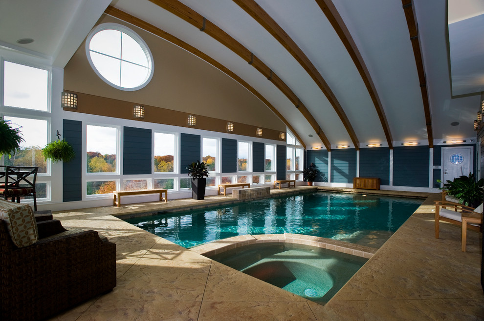 Imagen de piscinas y jacuzzis alargados actuales extra grandes rectangulares y interiores con suelo de hormigón estampado