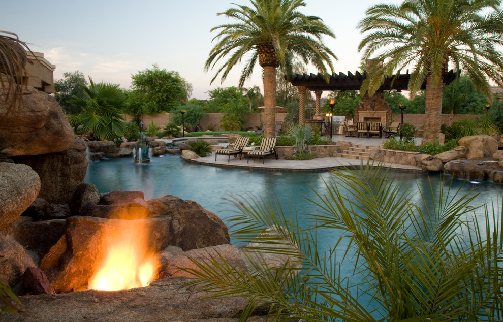 Inspiration for an expansive world-inspired custom shaped natural swimming pool in Phoenix.